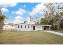 Updated ranch home, featuring a carport and spacious yard at 205 Larson Ave, Brandon, FL 33510