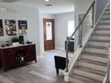 Spacious entryway with hardwood floors and a modern staircase at 5519 Turtle Crossing Loop, Tampa, FL 33625