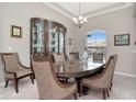 Formal dining room with a large table, chairs, and a china cabinet at 33161 Kateland Dr, Wesley Chapel, FL 33545