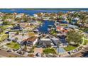 Wide aerial showcasing the neighborhood, waterways, and subject property at 5451 Bayou Grande Ne Blvd, St Petersburg, FL 33703