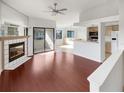 Open living area with hardwood floors and kitchen access at 2364 Hanover Dr, Dunedin, FL 34698
