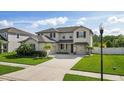 Two-story house with a large front yard and driveway at 12211 Streambed Dr, Riverview, FL 33579