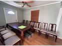 Spacious dining room with large wooden table and chairs at 6513 48Th N Ave, Kenneth City, FL 33709