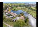 Stunning aerial view of waterfront property offering views of the lake and golf course at 1322 Pelican Creek Xing # B, St Petersburg, FL 33707