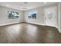 Spacious living room featuring wood-look floors and lots of natural light at 4642 Spahn St, Sarasota, FL 34232