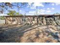 Brick house exterior with a screened porch and yard at 4613 W Fair Oaks Ave, Tampa, FL 33611