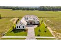 Aerial view of home and surrounding landscape showing the expansive yard and surrounding properties at 14036 Prairie Hill Rd, Dade City, FL 33525
