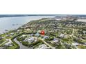 Panoramic aerial view of a waterfront community with canals leading to a wide river and views of the city at 505 Sally Lee Dr, Ellenton, FL 34222