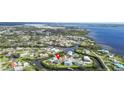Aerial view of a waterfront community showcasing beautiful homes with access to canals and a wide river at 505 Sally Lee Dr, Ellenton, FL 34222