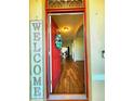 Inviting entryway showcasing wood-look flooring and an open view into the dining room at 109 Tierra Verde Way, Bradenton, FL 34212