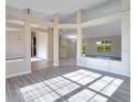Bright living room boasts an open floor plan and durable, stylish flooring at 14248 Salvatierra Ln, Port Charlotte, FL 33981