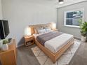 Comfortable bedroom featuring a bed, neutral color scheme, and large window, perfect for relaxation at 2956 Laurel Ct, Dunedin, FL 34698
