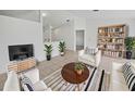 Bright living room with neutral tones, modern furniture, and stylish decor at 3593 Junction St, North Port, FL 34288