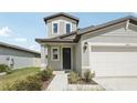 This house features stone accents, a well manicured lawn and an inviting entrance at 2318 E Newsome Rd, Plant City, FL 33565