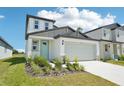 Beautifully landscaped two-story home with a two-car garage and well-manicured lawn at 3912 Radiant Mountain Dr, Plant City, FL 33565