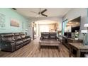 Spacious living room features modern ceiling fan and open layout to the kitchen at 5320 Aqua Breeze Dr, Bradenton, FL 34208