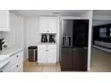 Kitchen featuring stainless steel refrigerator and stainless steel trash can at 3818 Moog Rd, Holiday, FL 34691