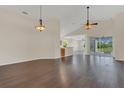 Spacious living room with hardwood floors and abundant natural light from sliding glass doors at 11530 57Th Street E Cir, Parrish, FL 34219