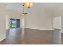 Bright living area with hardwood floors and sliding glass doors opening to the lanai at 11530 57Th Street E Cir, Parrish, FL 34219