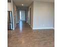 Inviting entryway with tile flooring, neutral paint, and direct access to the kitchen, hall, and front door at 345 Mangrove Manor Dr, Apollo Beach, FL 33572