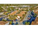 Aerial view showcasing the condo community's lush landscaping, parking, and building exteriors at 6320 Newtown Cir # 20B1, Tampa, FL 33615