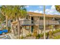 Charming two-story condo with a quaint balcony, neat landscaping, and convenient parking at 6320 Newtown Cir # 20B1, Tampa, FL 33615