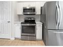Modern kitchen with stainless steel appliances and granite countertops at 3328 Circleville St, North Port, FL 34286
