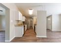Bright kitchen with stainless steel appliances and wood flooring at 4702 E Idlewild Ave, Tampa, FL 33610