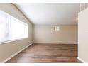 Spacious living room with large window and modern flooring at 4702 E Idlewild Ave, Tampa, FL 33610