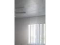 Bright room with a large window and blinds at 3824 N Lake Dr # 108, Tampa, FL 33614