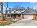 Beautiful home with a brick facade, a spacious driveway, and a classic architectural style at 6604 Stafford Terrace Ave, Plant City, FL 33565