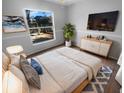 Bright bedroom featuring a cozy bed, stylish furnishings, and natural light at 8103 Rhanbuoy Rd, Spring Hill, FL 34606