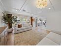 Bright living room features coffered ceilings, an open floor plan and recessed lighting at 7746 Westmoreland Dr, Sarasota, FL 34243