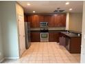 Well-equipped kitchen featuring stainless steel appliances and dark wood cabinets at 6699 46Th N Ln, Pinellas Park, FL 33781