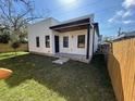 Well-maintained backyard featuring a new fence and lush greenery at 2604 E 11Th Ave, Tampa, FL 33605