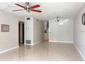 Spacious living room featuring neutral colors, a ceiling fan and tiled floors at 4143 57Th N St # 502, Kenneth City, FL 33709