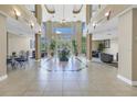 Spacious lobby with tiled flooring, a water feature, and comfortable seating areas at 750 4Th S Ave # 601H, St Petersburg, FL 33701