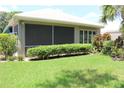 Enjoy the Florida weather on this screened-in porch with sliding glass doors at 5011 88Th E St, Bradenton, FL 34211