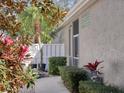 A side yard featuring plants, walkway, and white fence at 5011 88Th E St, Bradenton, FL 34211