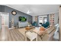 Comfortable living room with stylish furniture, modern decor, and sliding glass doors to the outdoors at 6731 Ranger Dr, Tampa, FL 33615