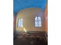 Interior room with a unique architectural style, featuring a blue domed ceiling and arched windows at 1827 2Nd E Ave, Bradenton, FL 34208