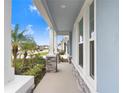 Inviting front porch with stone accents and a view of the neighborhood at 31534 Westbury Estates Ave, Wesley Chapel, FL 33545