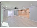 Open living room featuring lots of natural light, neutral paint, fan, and durable flooring at 12339 138Th N St, Largo, FL 33774