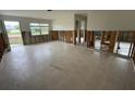 Bright living room with ample natural light from the window and a view of a serene outdoor area at 1998 Cove Dr, Largo, FL 33774