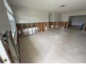Spacious living room with tile floors, ready for renovation and personal touches to be added at 1998 Cove Dr, Largo, FL 33774