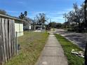 A peaceful neighborhood street view, showcasing the community and nearby sidewalks at 3235 Delray Dr, Tampa, FL 33619