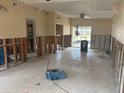 Large Living Room with tile flooring, ceiling fan, and exposed wall framing at 411 Shore E Dr, Oldsmar, FL 34677