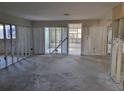 View of a Living Room with exposed framing ready for renovation and personalization at 6220 Keller Dr, Port Richey, FL 34668