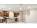 Bright and airy kitchen featuring modern appliances, granite countertops, and ample cabinet space at 6310 116Th E Ave, Parrish, FL 34219