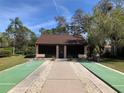 Community shuffleboard court with benches and a walkway leading to the playing area at 6211 Timber Lake Dr # B4, Sarasota, FL 34243